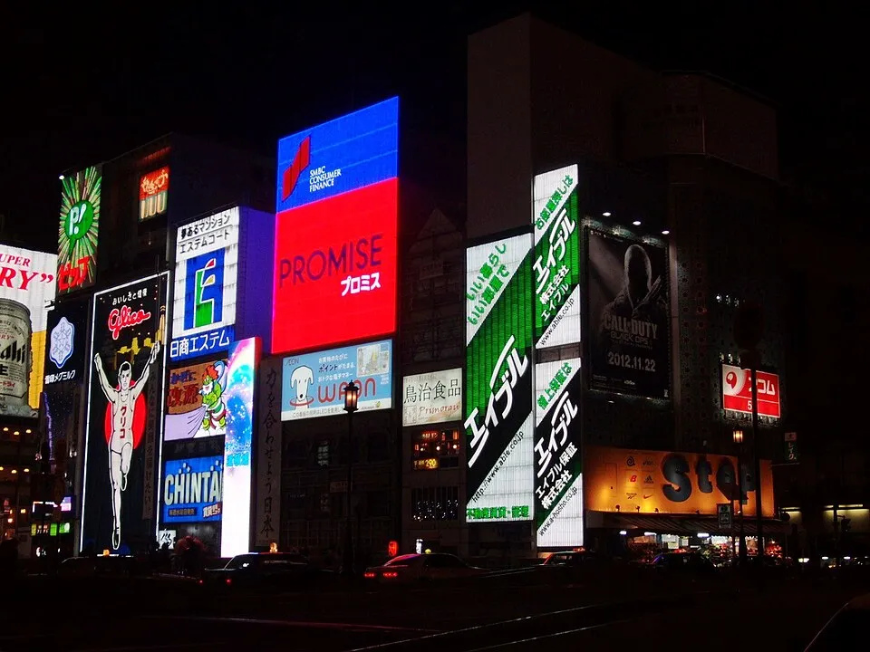 Neon signs over the Dotonbori canal in Osaka at night