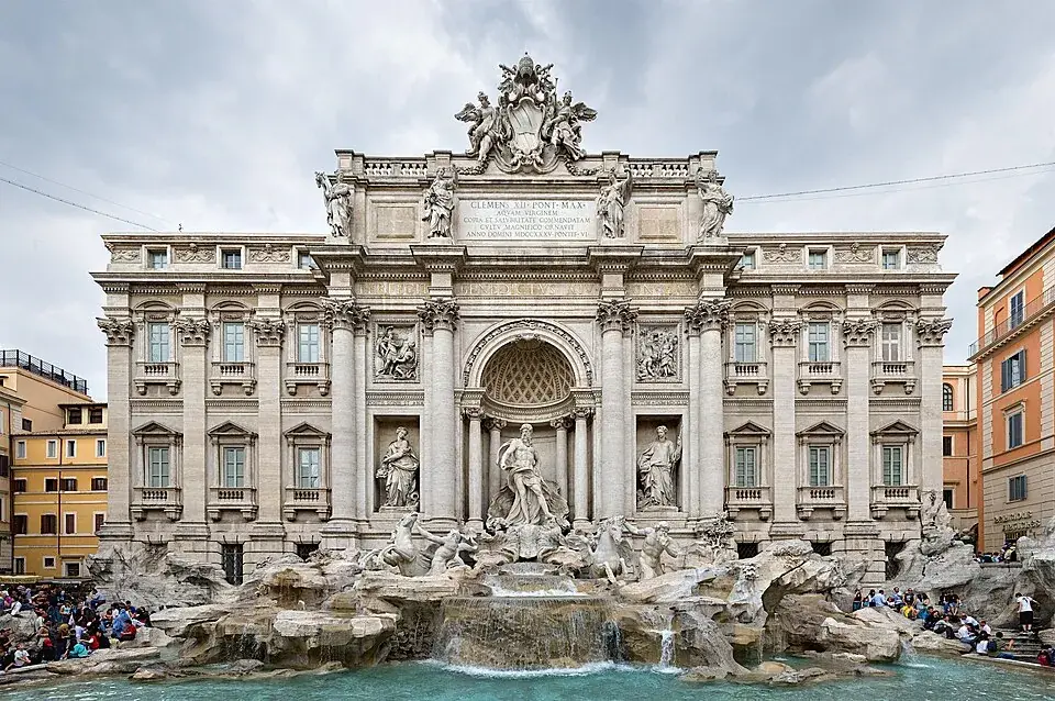 The Trevi Fountain in Rome, with visitors around its basin