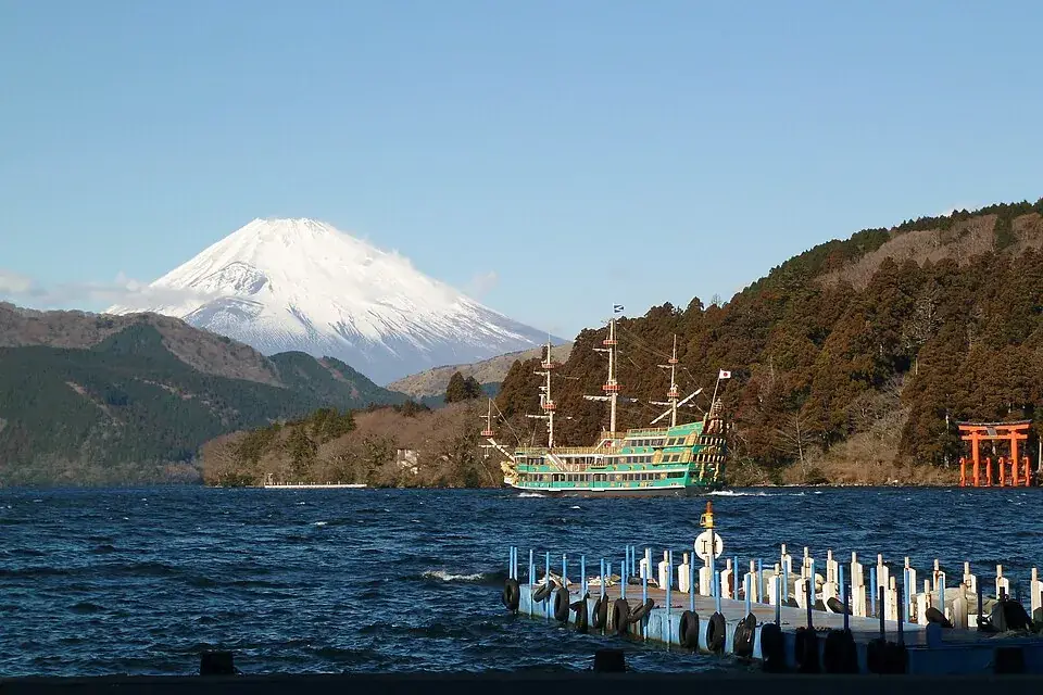 Mount Fuji above Lake Ashi in Hakone, with a sightseeing boat on the water