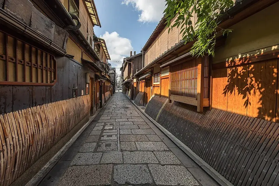 Wooden houses with bamboo blinds along a cobbled lane in Gion